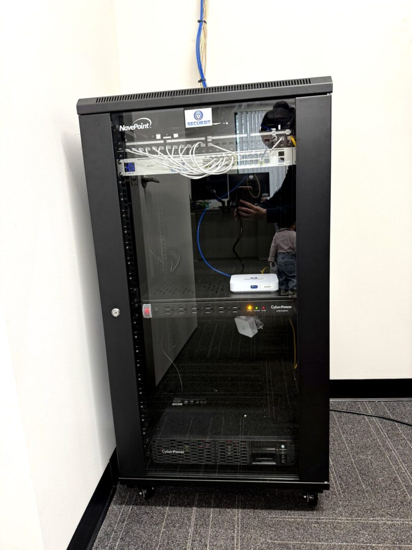 Secur3iT full network rack installation with patch panel, UniFi switch, and CyberPower UPS